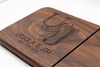 Close-up of personalized walnut cheese slicer engraved with couples monogram, names, and anniversary date