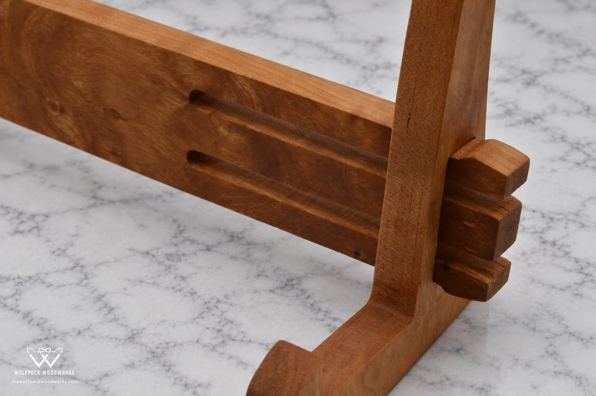 Close-up of the precision-cut interlocking joint on a solid hardwood cutting board stand