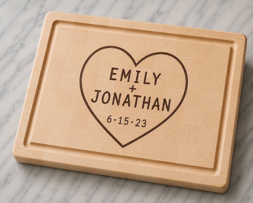 Maple end grain cutting board with engraved heart design, couple names, and anniversary date