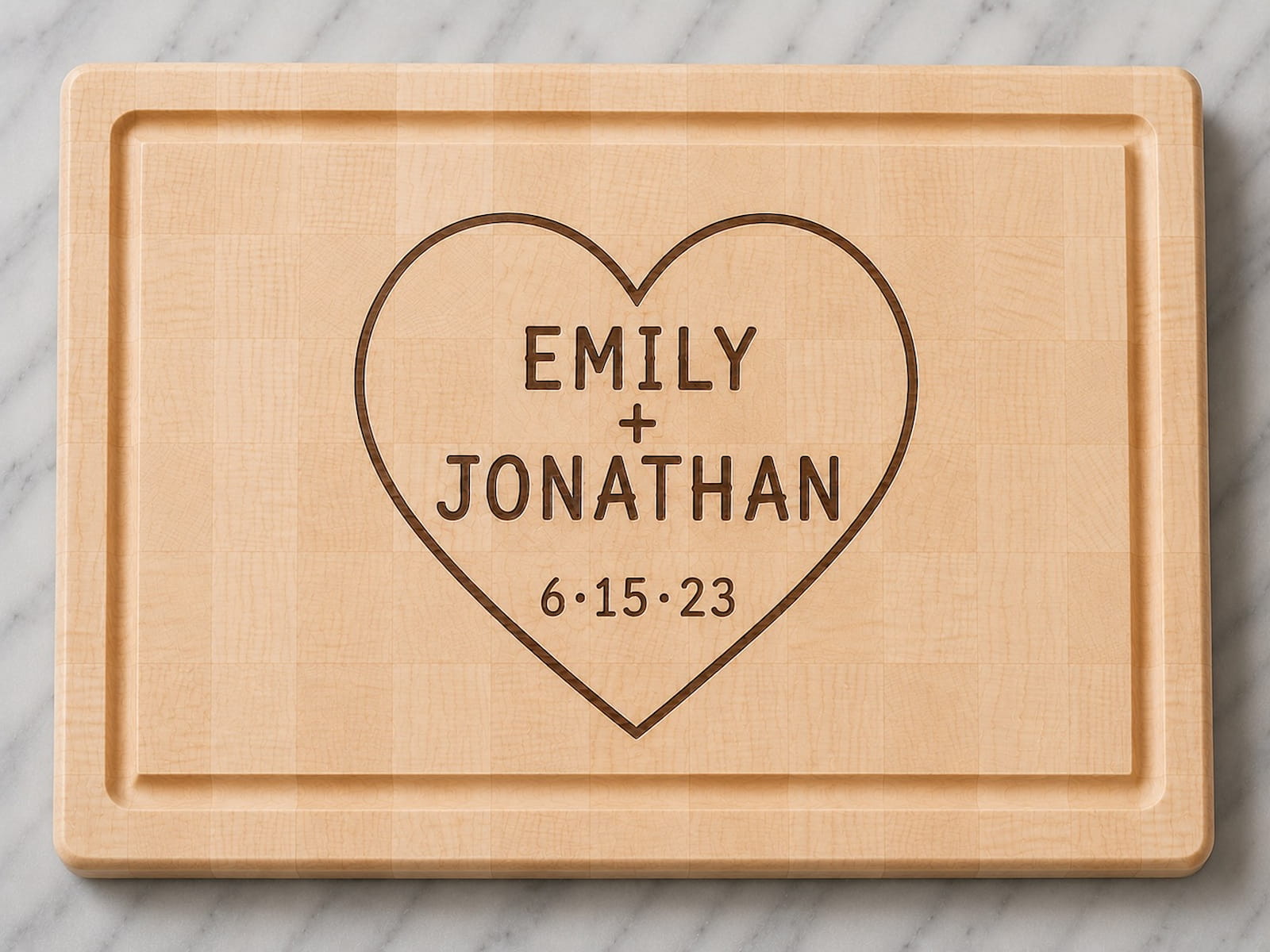 Maple end grain cutting board engraved with couples names, anniversary date, and heart design