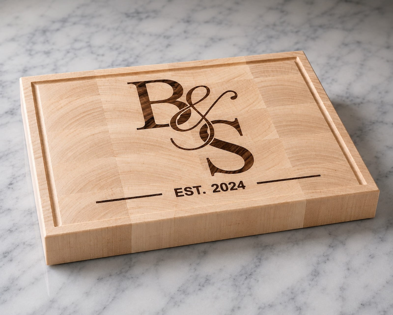 Maple end grain cutting board with walnut couples monogram inlay and established 2024 engraving