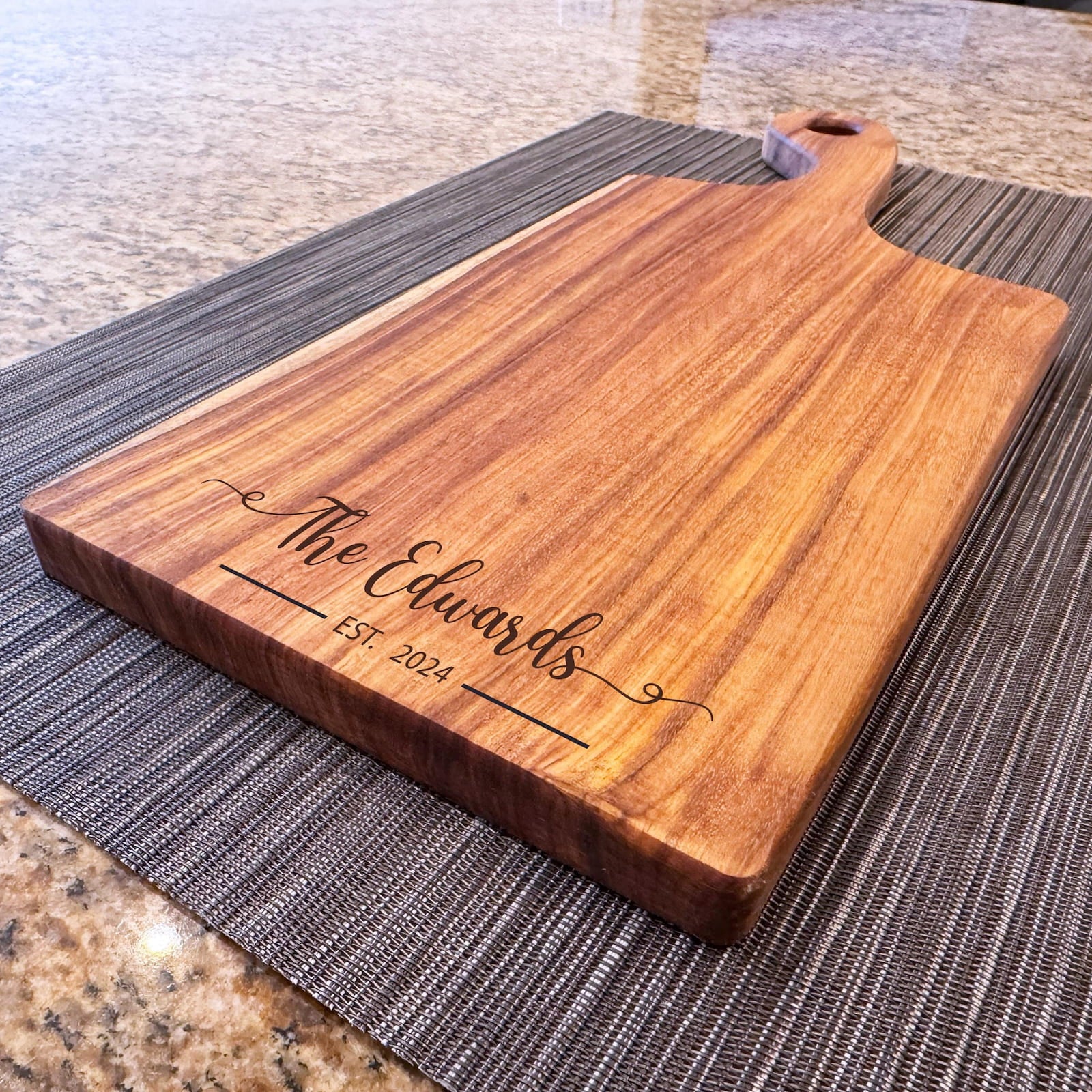 Personalized canary wood charcuterie board with engraved family name and handle