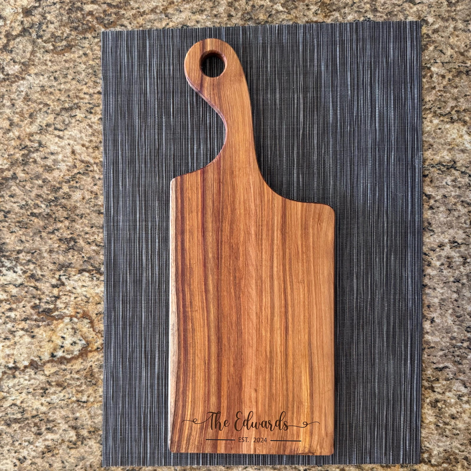 Personalized canary wood charcuterie board with engraved family name and handle