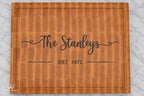 Top view of personalized maple end grain cutting board with Stanley family name and established date inlay