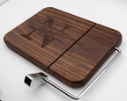 Personalized walnut cheese slicer with engraved split monogram family name design on white background