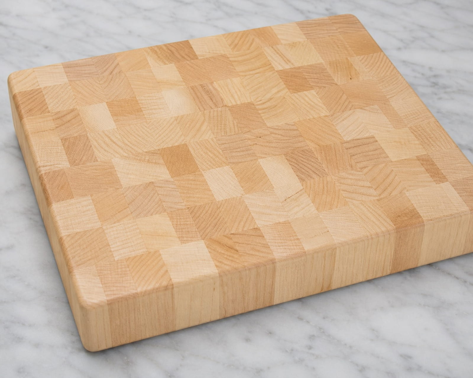 Plain maple end grain cutting board with natural hardwood grain pattern