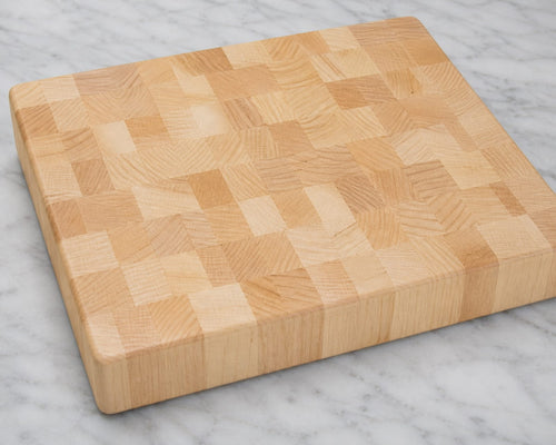 Plain maple end grain cutting board showcasing natural hardwood block pattern and smooth butcher block surface