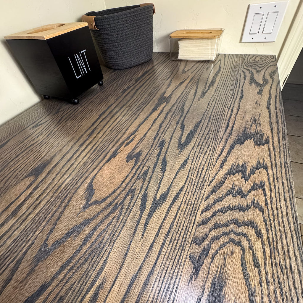 Solid oak laundry room countertop with dark stain and satin polyurethane finish