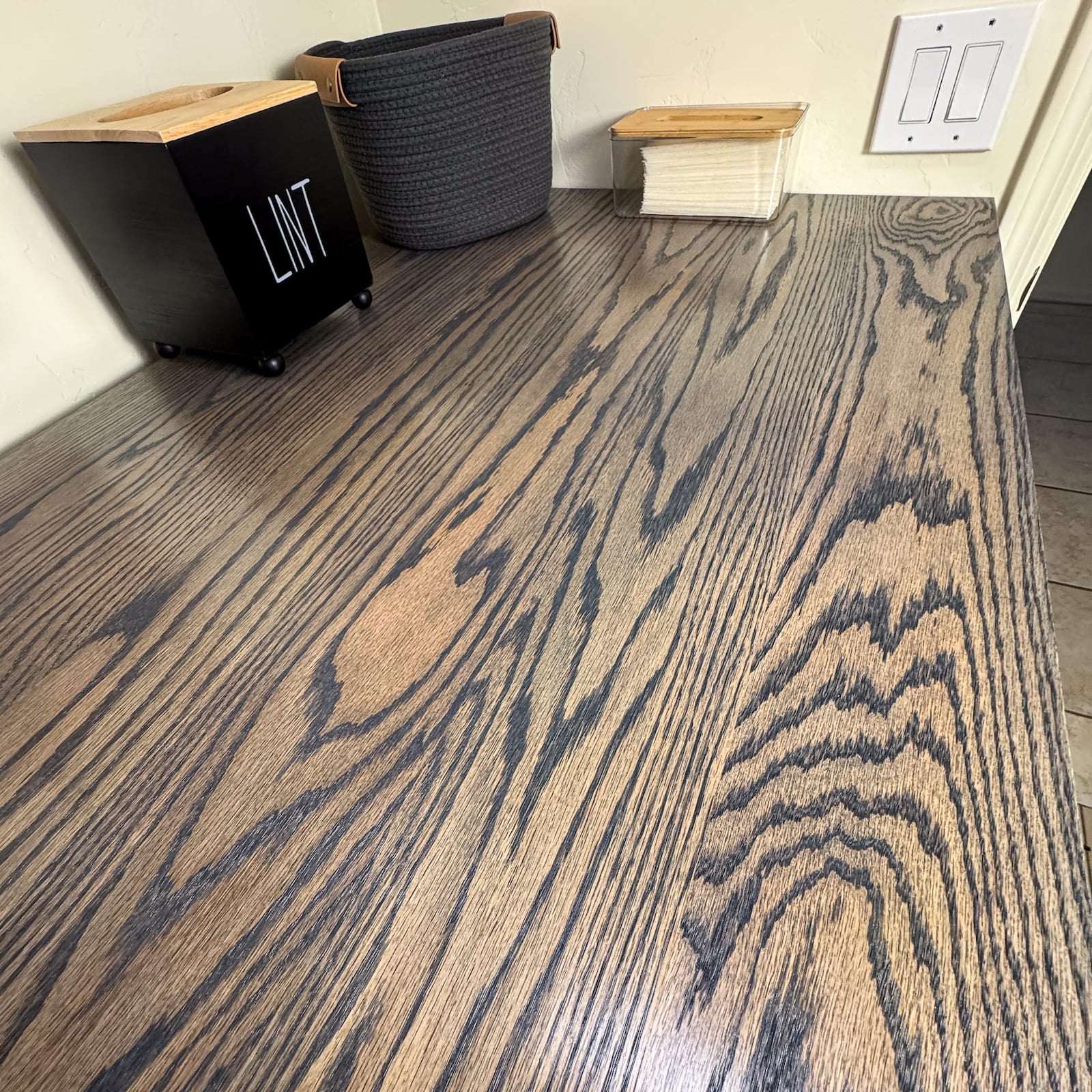 Solid oak laundry room countertop with dark stain and satin polyurethane finish