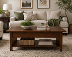 Solid wood coffee table with lower shelf storage styled in a warm modern living room