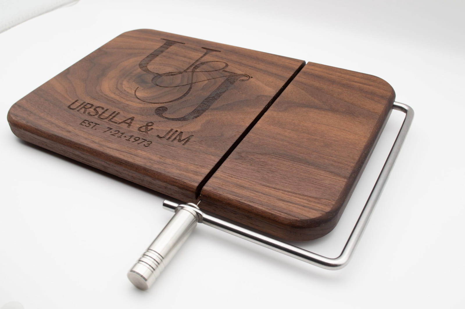 Walnut cheese slicer engraved with couples monogram, names, and anniversary date