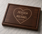 Walnut end grain cutting board engraved with couples names, anniversary date, and heart design