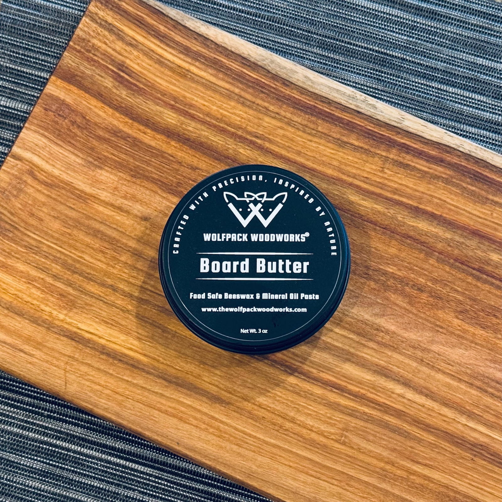 Wolfpack Woodworks board butter tin on handcrafted canary wood serving board
