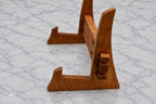Side view of solid hardwood cutting board stand showing the interlocking support design