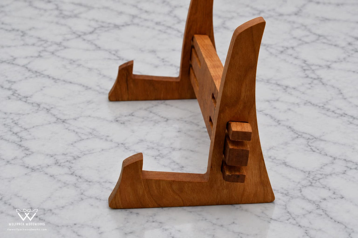 Side view of solid hardwood cutting board stand showing the interlocking support design